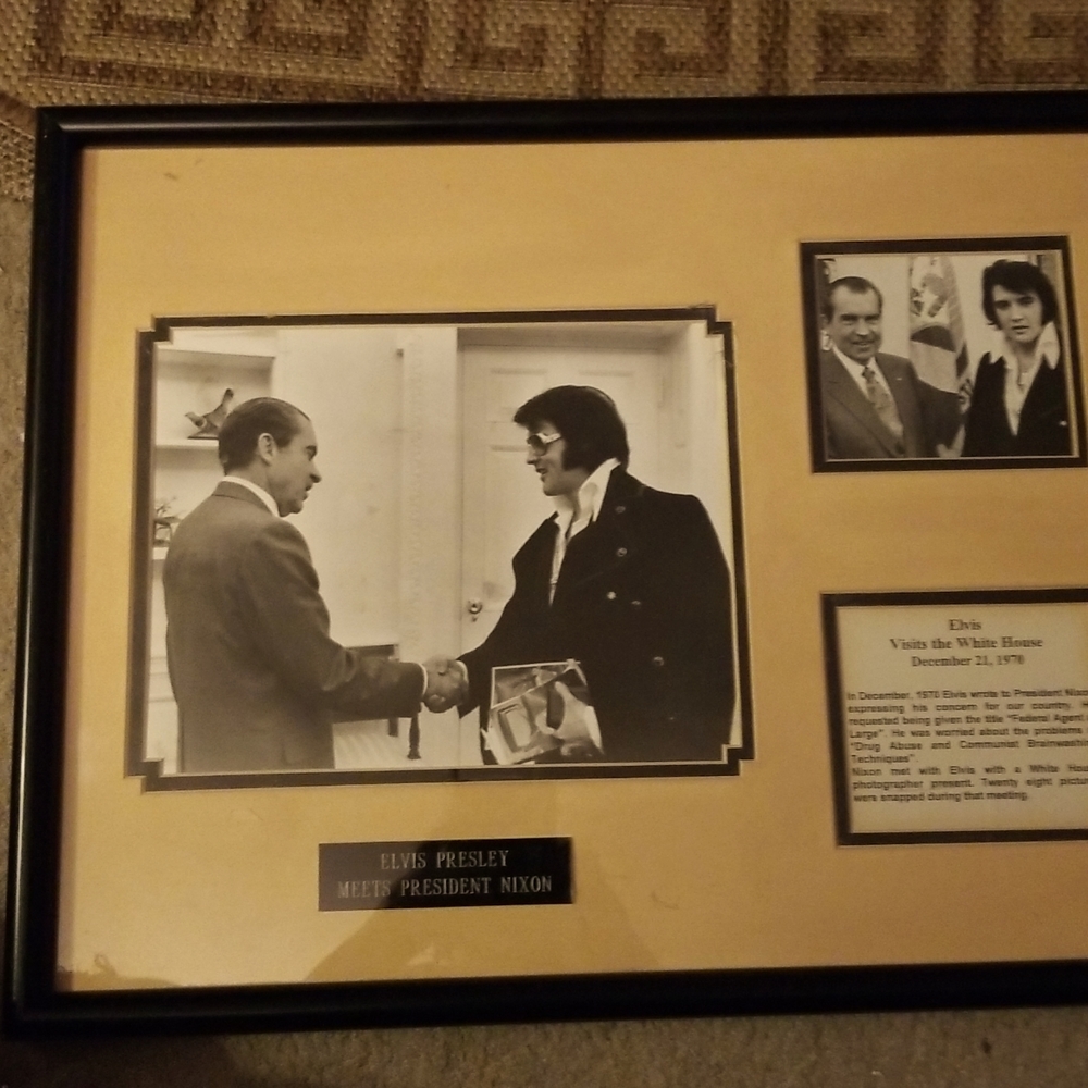 A Framed Black And White Photo of Elvis Presley and President Nixon.